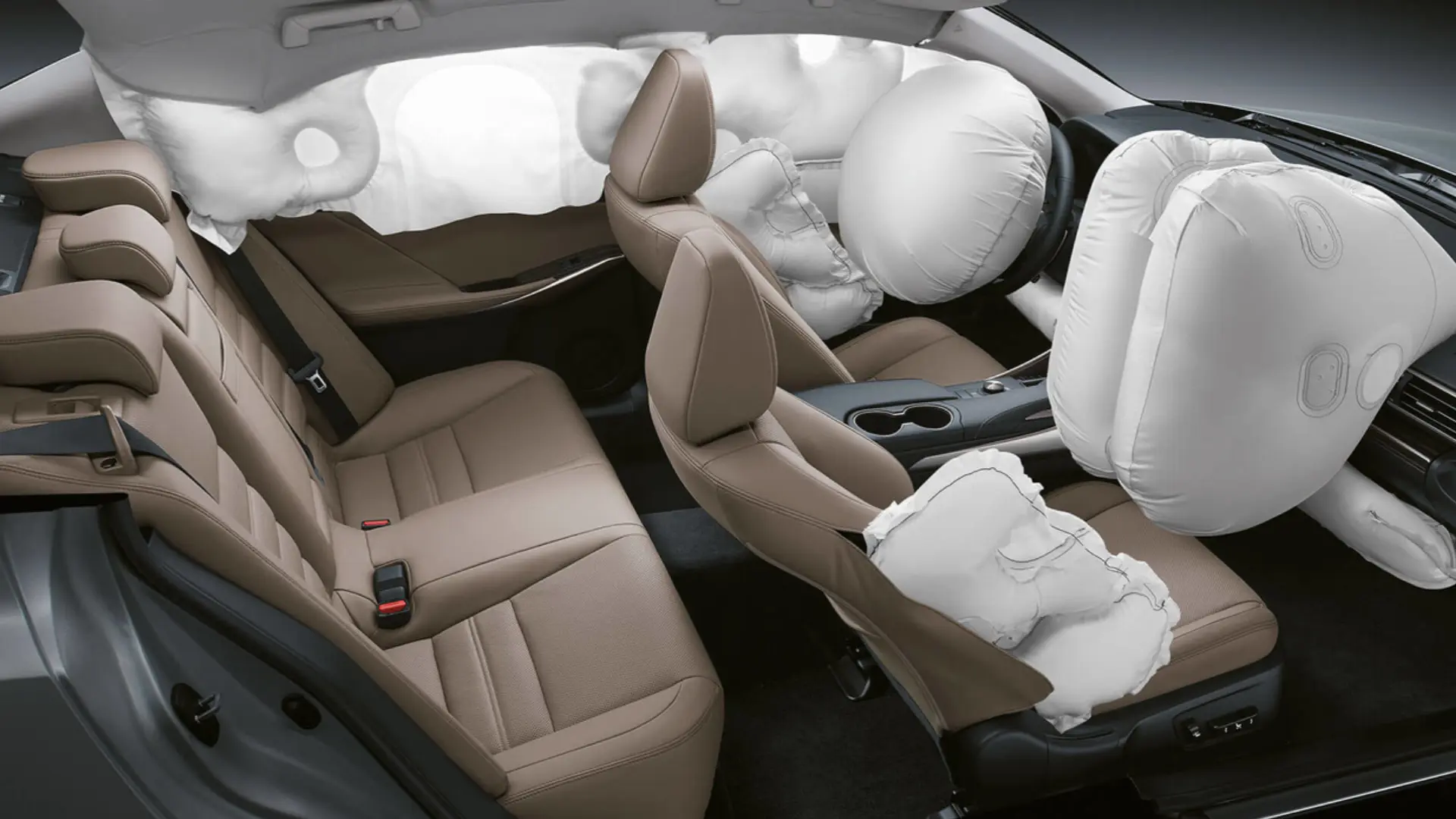 car interior showing multiple deployed airbags across front seats, dash, and side panels