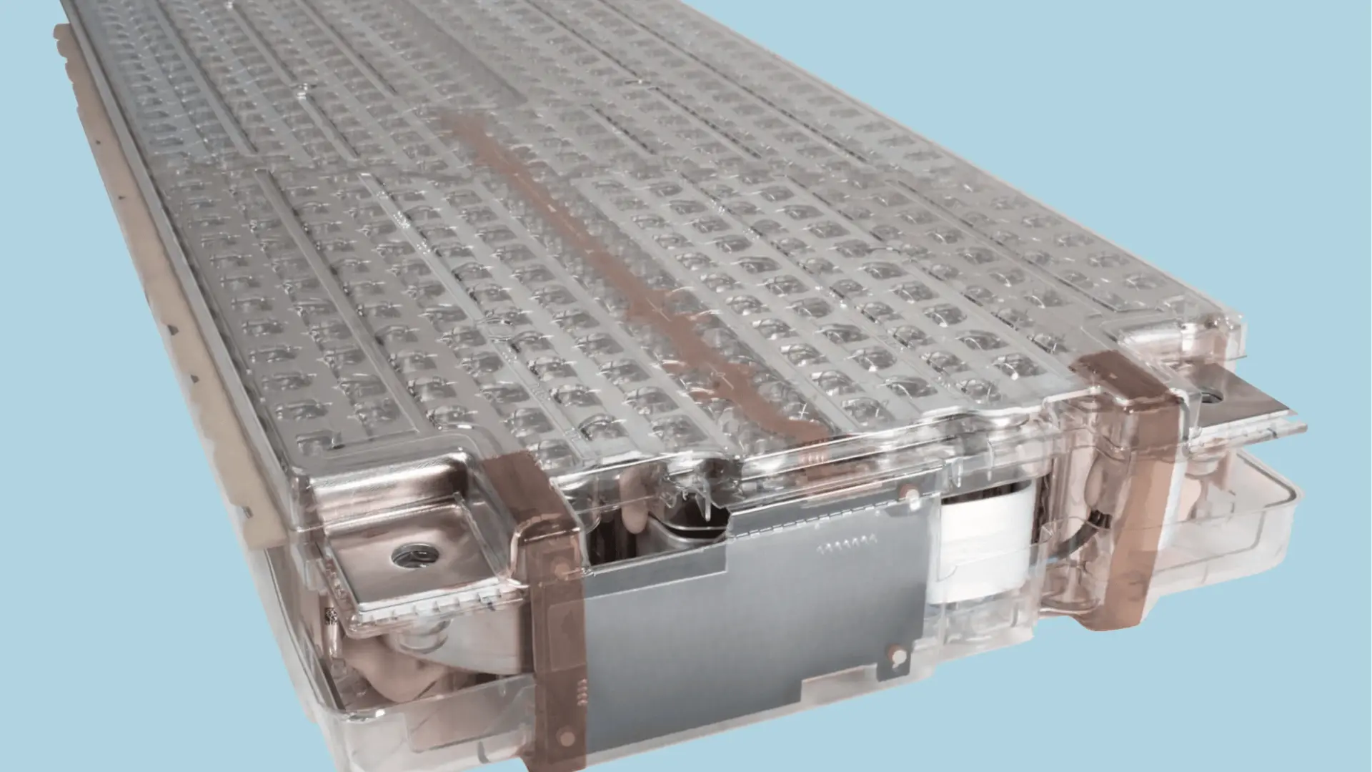 complete tesla battery pack on a wheeled frame, showing the large flat black enclosure with bms unit