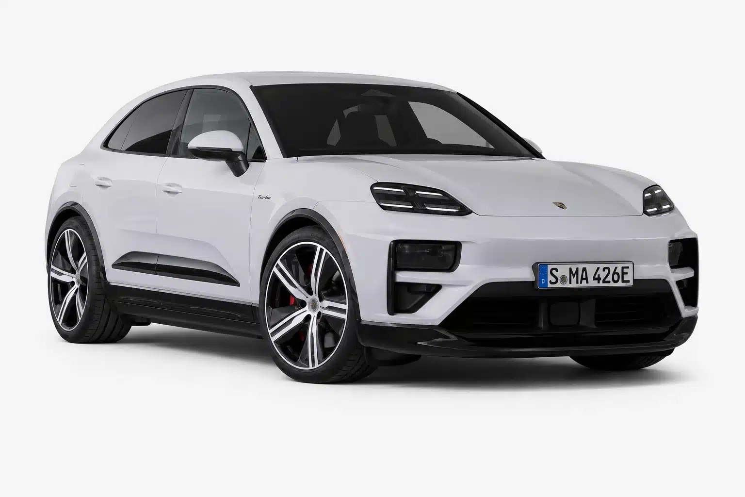 White Porsche Macan Turbo SUV shown from front side on a clean light studio background.